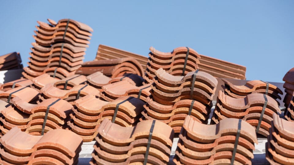 Stacks of Spanish tile are shown, allowing the viewer to see the S shape of the tiles.